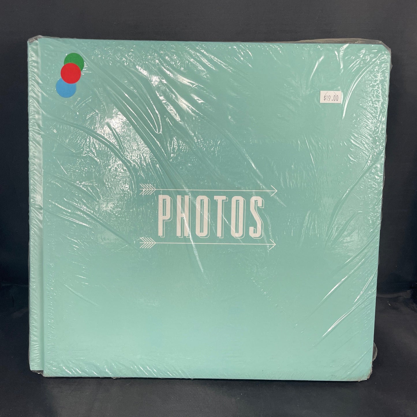 Mint Green Album with print that says "Photos" between 2 arrows pointing to the  right 